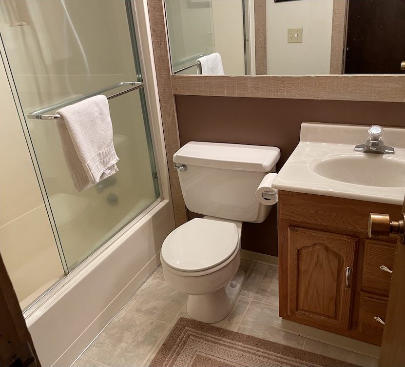 Hall bathroom with tub and shower